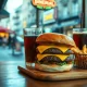 Cheeseburger, fries and soda on a restaurant table, representing the DoorDash Cheeseburger Index