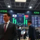 Currency exchange board showing the Japanese yen and South Korean won with upward arrows during a joint intervention.