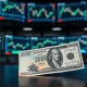 Japanese Yen and US Dollar banknotes on a desk with forex charts in the background