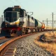 Freight train on railway tracks representing L.B. Foster rail technology and infrastructure growth