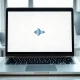 MacBook displaying Meta AI assistant with dictation interface on a desk