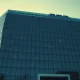 Exterior of a modern tech office building, representing Meta's headquarters, under a clear sky.
