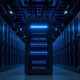Server racks in a data center with one glowing blue server rack in the foreground