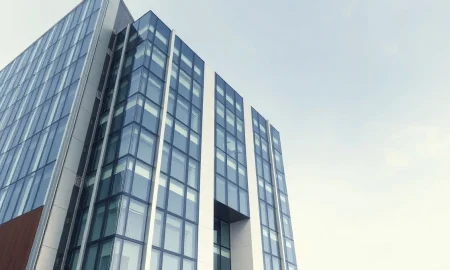 Modern corporate office building exterior, representing OpenAI's headquarters, in a news context.