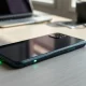 Google Pixel 11 Pro XL face-down with glowing green LED notification light on its back