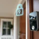 Ring video doorbell camera mounted outside a home, representing new TAKE encryption for cloud features.
