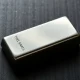 A polished silver bar on a dark surface, representing the silver market.