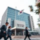Bank of Korea headquarters in Seoul with South Korean flag, symbolizing monetary policy decisions