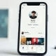 Smartphone displaying Spotify artist profile with AI Persona badge