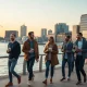 Stockholm skyline with young professionals discussing near the waterfront at golden hour