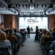 TechBBQ 2026 conference hall in Copenhagen with a panel discussion on AI sovereignty on stage