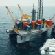 Offshore oil and gas platform at sea representing TechnipFMC's subsea engineering business