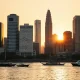 Bangkok skyline at sunset reflecting on the Chao Phraya River