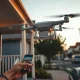Zipline delivery drone hovering above a residential street for an Uber Eats order