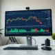 Analyst reviewing ETF flow data on a monitor showing a declining chart