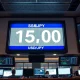 Digital exchange board in Tokyo showing USD/JPY rate at 159.00
