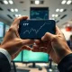 Analyst monitoring Chinese yuan exchange rates on a smartphone in a financial office