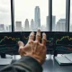Crude oil futures trading desk with price charts on monitors and a trader reviewing data