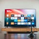 TV streaming interface with a scale of justice in foreground, symbolizing antitrust review of Fox-Roku deal