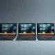 Five open Googlebook laptops in a row, each with a glowing exterior light bar