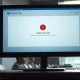 Microsoft Outlook email interface showing an error on a desktop monitor during an outage