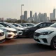 Row of cars representing Carrum Mobility's fleet in an Indian city