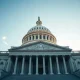 U.S. Capitol building in Washington, D.C., under a clear sky, symbolizing federal fiscal challenges.